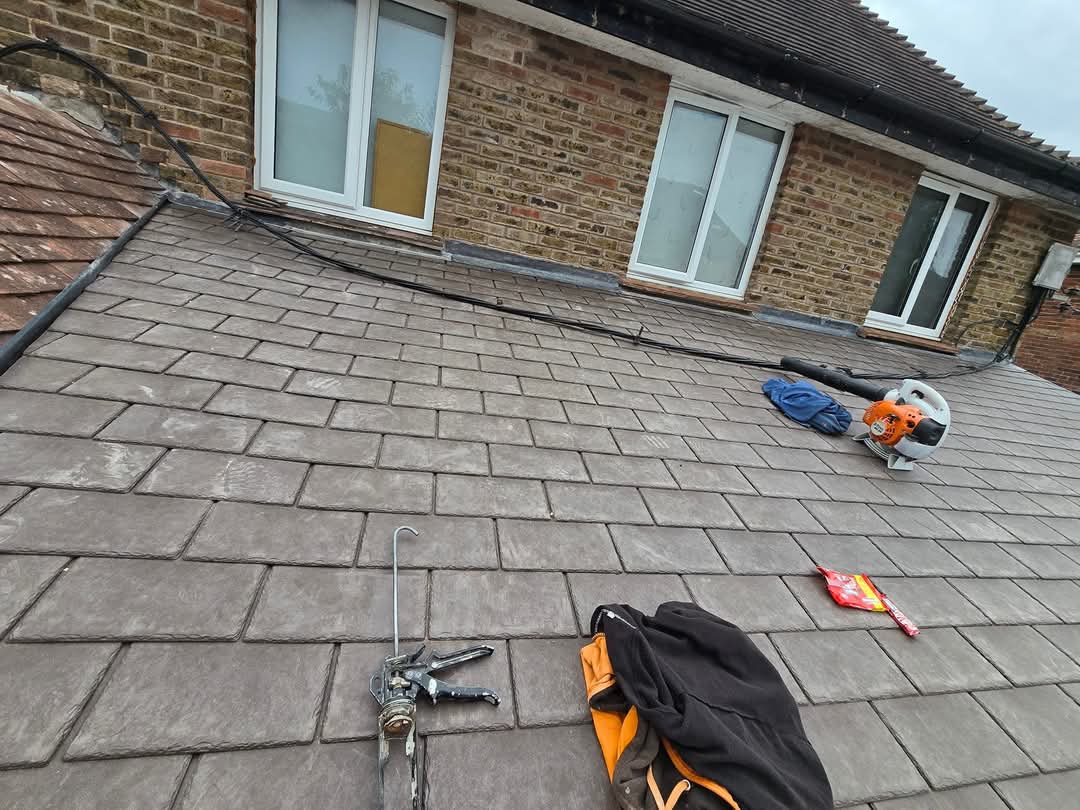 Slate roof field laid by customer with GRP valley and flashings finished by Lordys