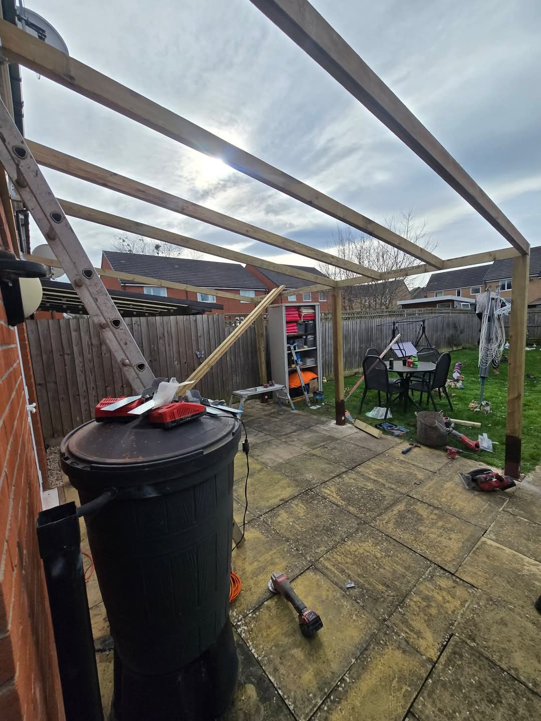 Rafters being fitted to lean-to timber frame