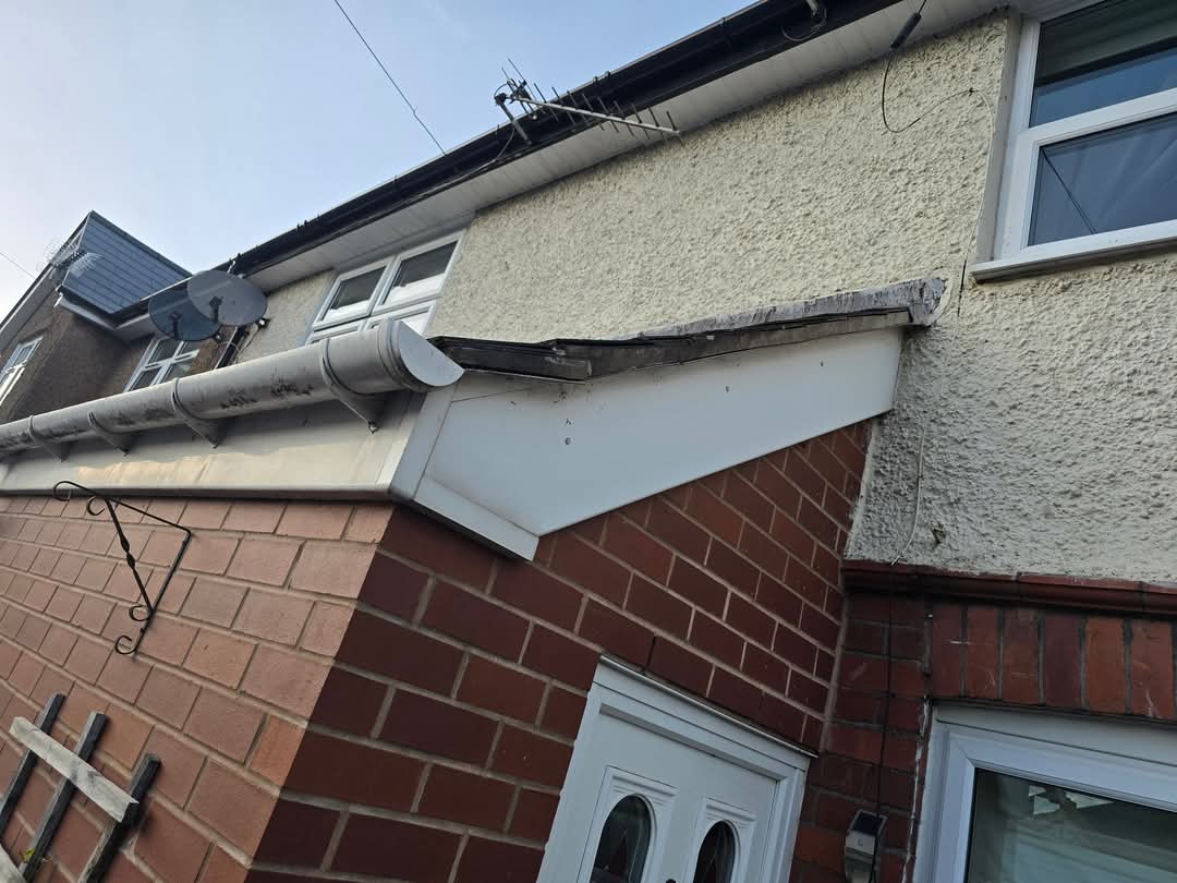 Before — Tired fascia, failing detail.