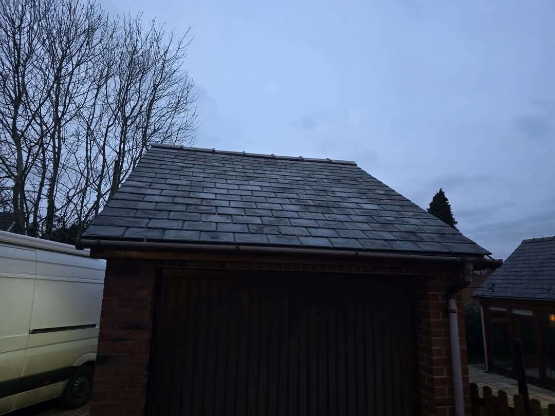 Completed slate garage roof at dusk