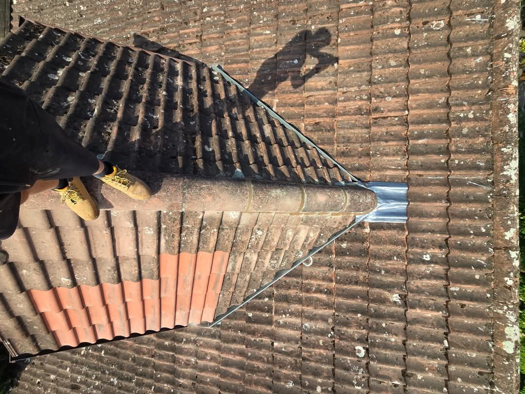 New GRP dry valley fitted between two pitched tile roofs