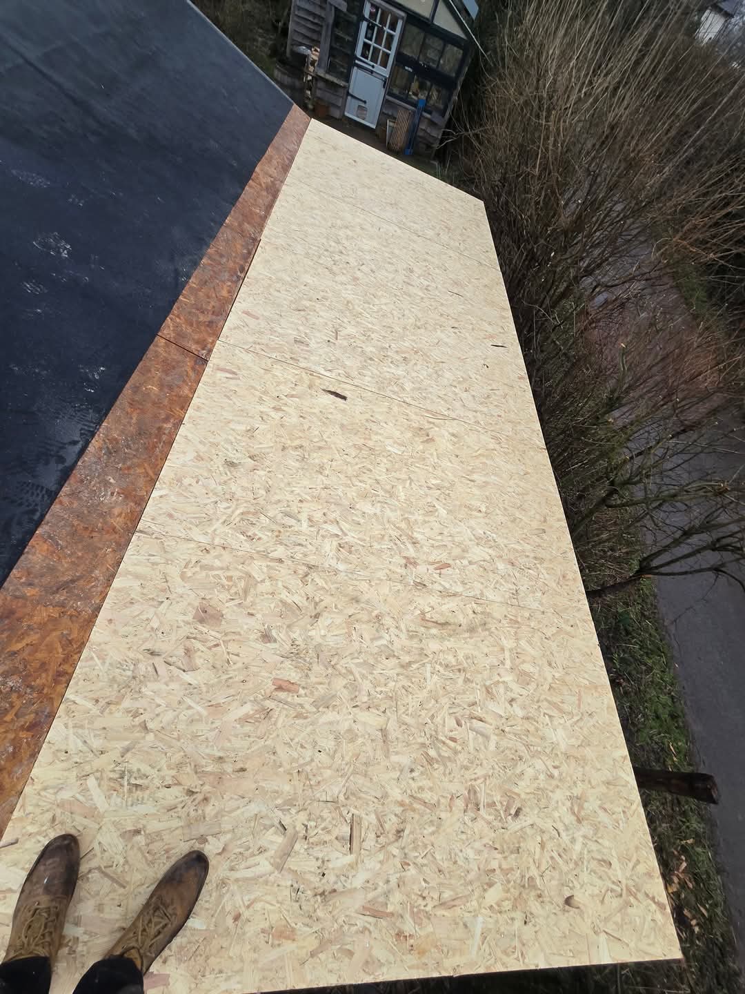 Fresh OSB deck sistered into existing EPDM ready for new membrane